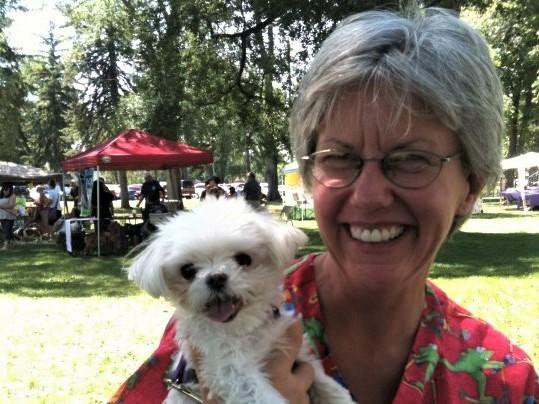 Patty holding a small white dog